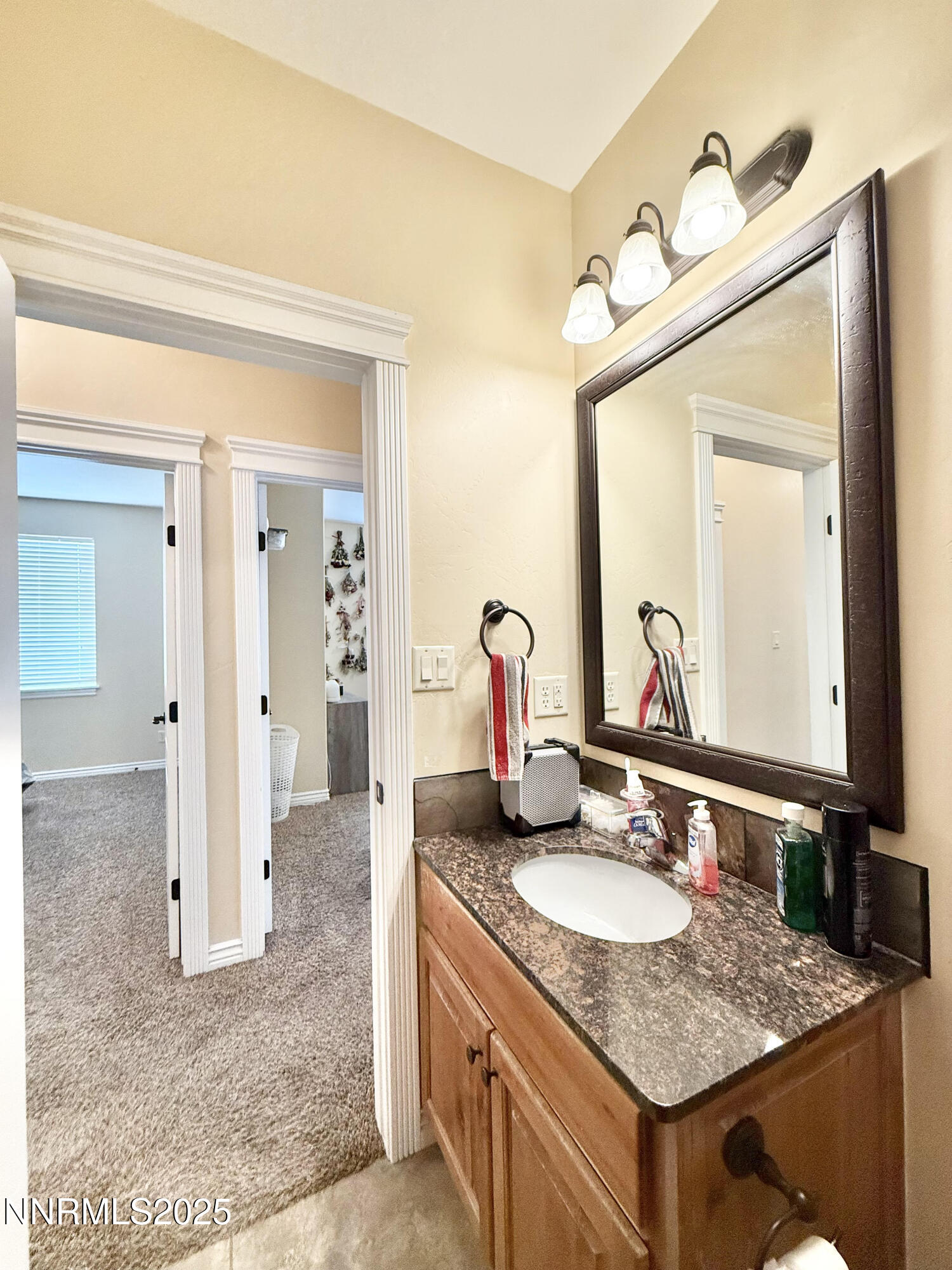 170 Blue Ridge Road Battle Mountain, NV 89820 - Photo 30 of 42 a bathroom with a granite countertop sink and a mirror