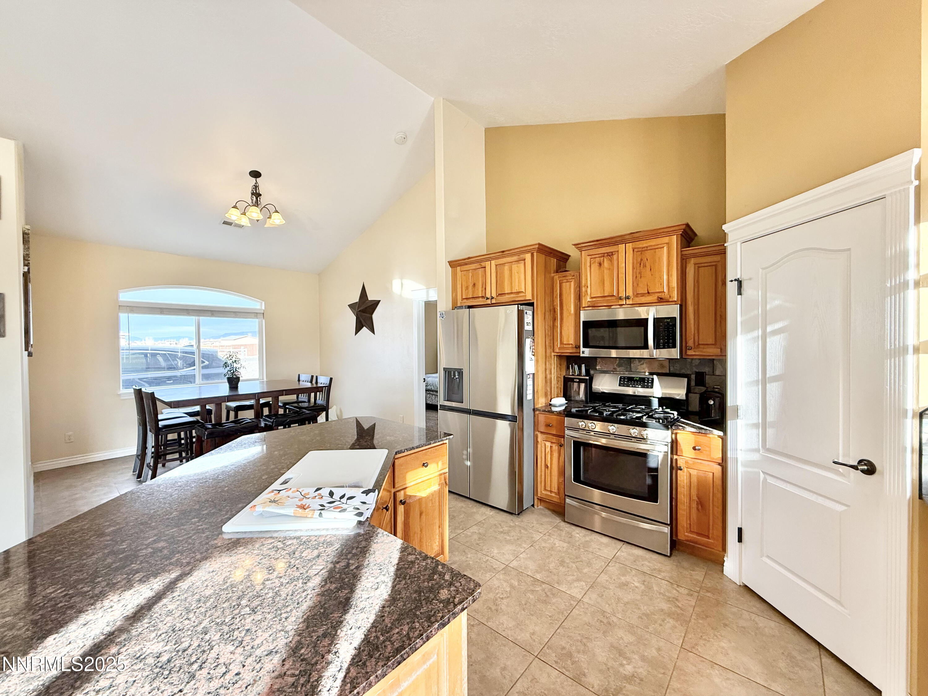 170 Blue Ridge Road Battle Mountain, NV 89820 - Photo 7 of 42 a living room with stainless steel appliances furniture a rug and a kitchen view