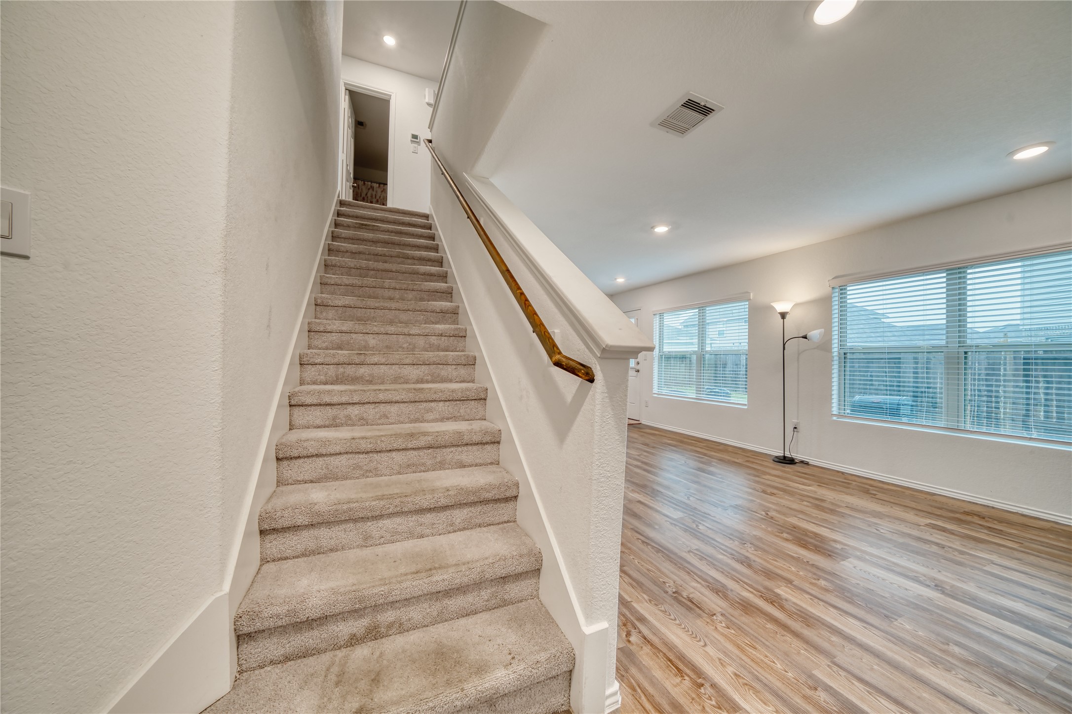 184 Kelly Street Angleton, TX 77515 - Photo 6 of 19 As you enter the front door you'll be greeted by the staircase that leads to the 2nd floor as well as the open concept living area.
