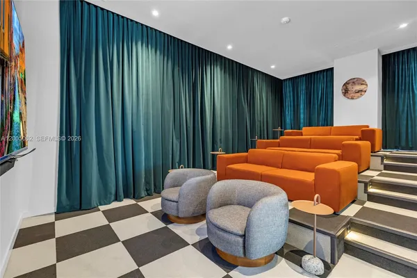 a bedroom with furniture and a rug