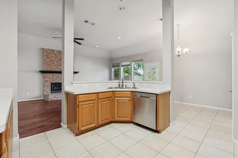 a kitchen with stainless steel appliances granite countertop a sink and cabinets