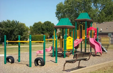 an outdoor space with furniture and barbeque oven
