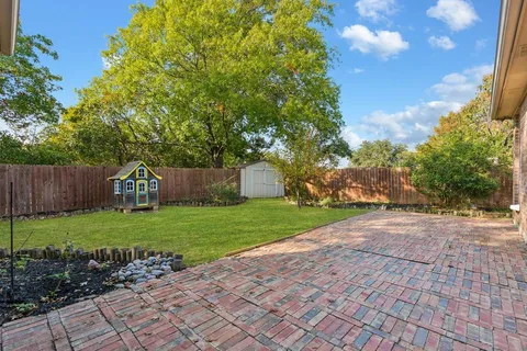 a kitchen with stainless steel appliances granite countertop a sink dishwasher stove and cabinets