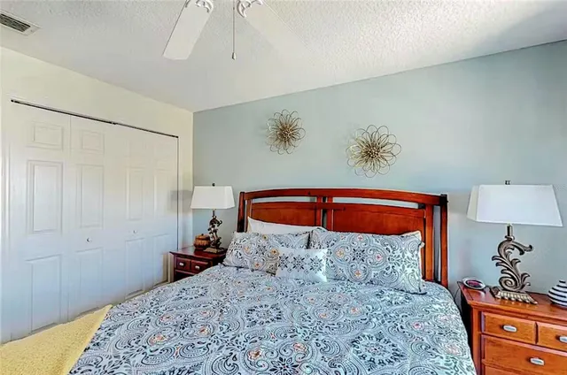 a bedroom with a bed and a dresser in it