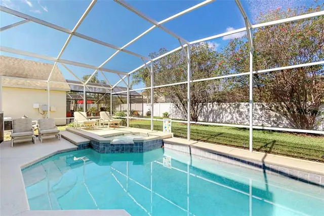 a view of swimming pool with outdoor seating