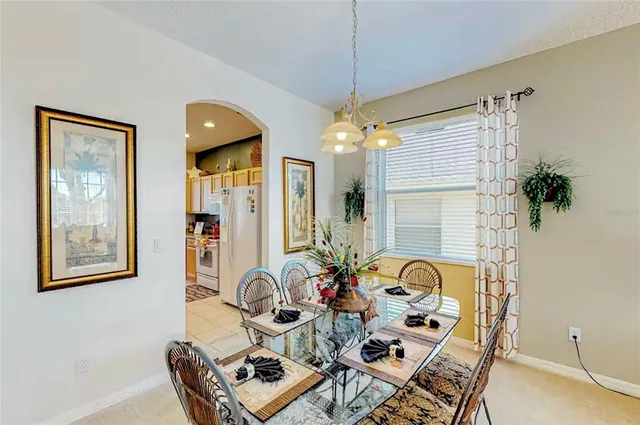 a view of a workspace with furniture and a chandelier