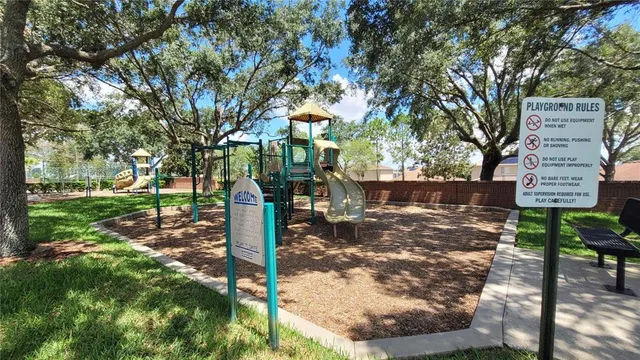 a view of a park with large trees