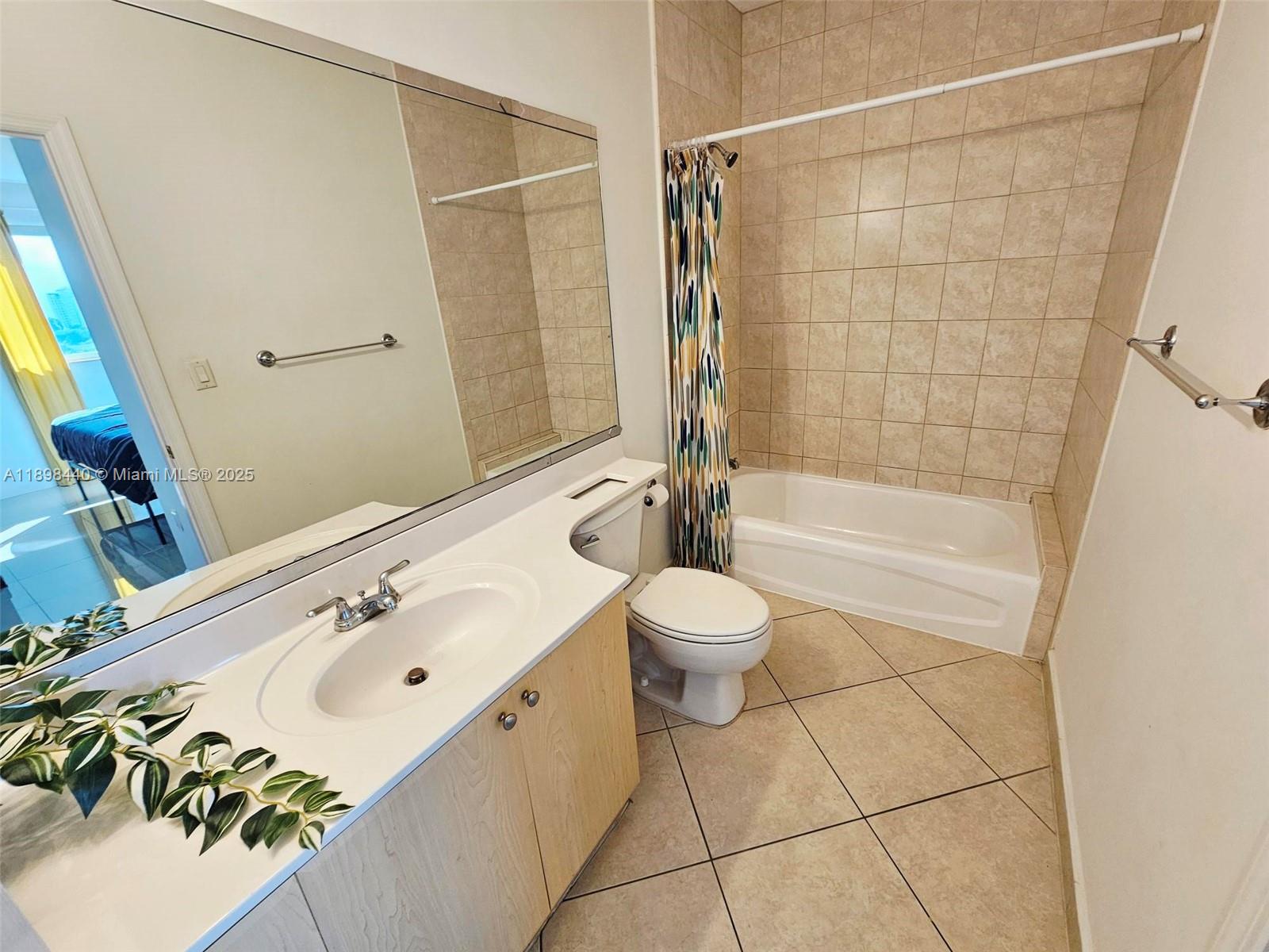 2280 Southwest 32nd Avenue, Unit 511 Miami, FL 33145 - Photo 13 of 17 a bathroom with a sink toilet and shower