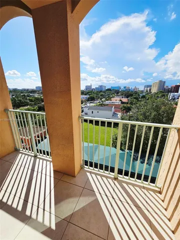 a view of balcony with wooden floor