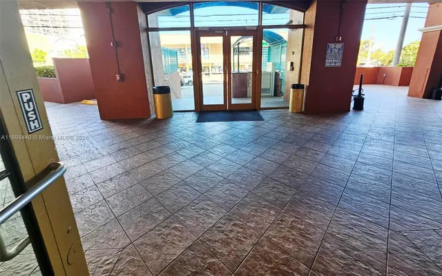 a view of an empty room with a window