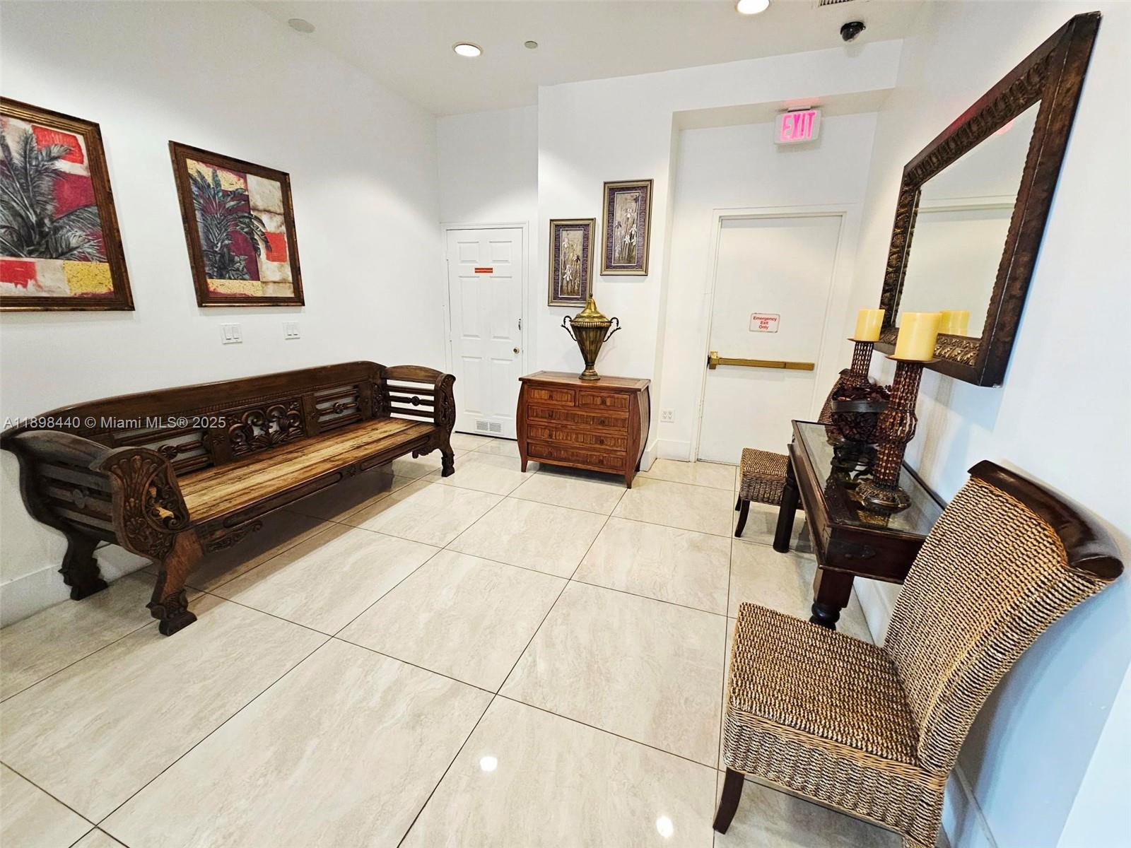 2280 Southwest 32nd Avenue, Unit 511 Miami, FL 33145 - Photo 17 of 17 a living room with furniture and a flat screen tv