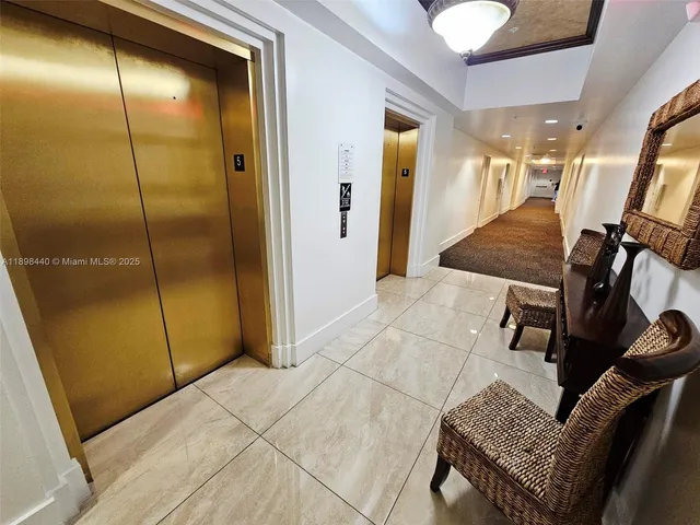 a view of a hallway with elevator