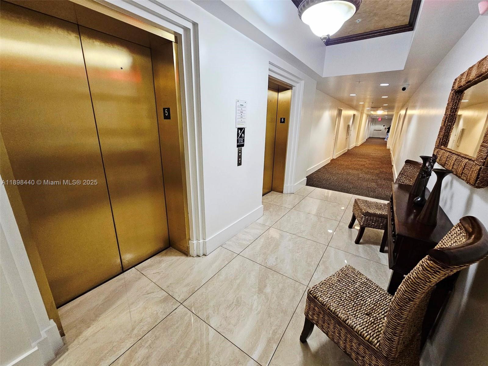 2280 Southwest 32nd Avenue, Unit 511 Miami, FL 33145 - Photo 4 of 17 a view of a hallway with elevator