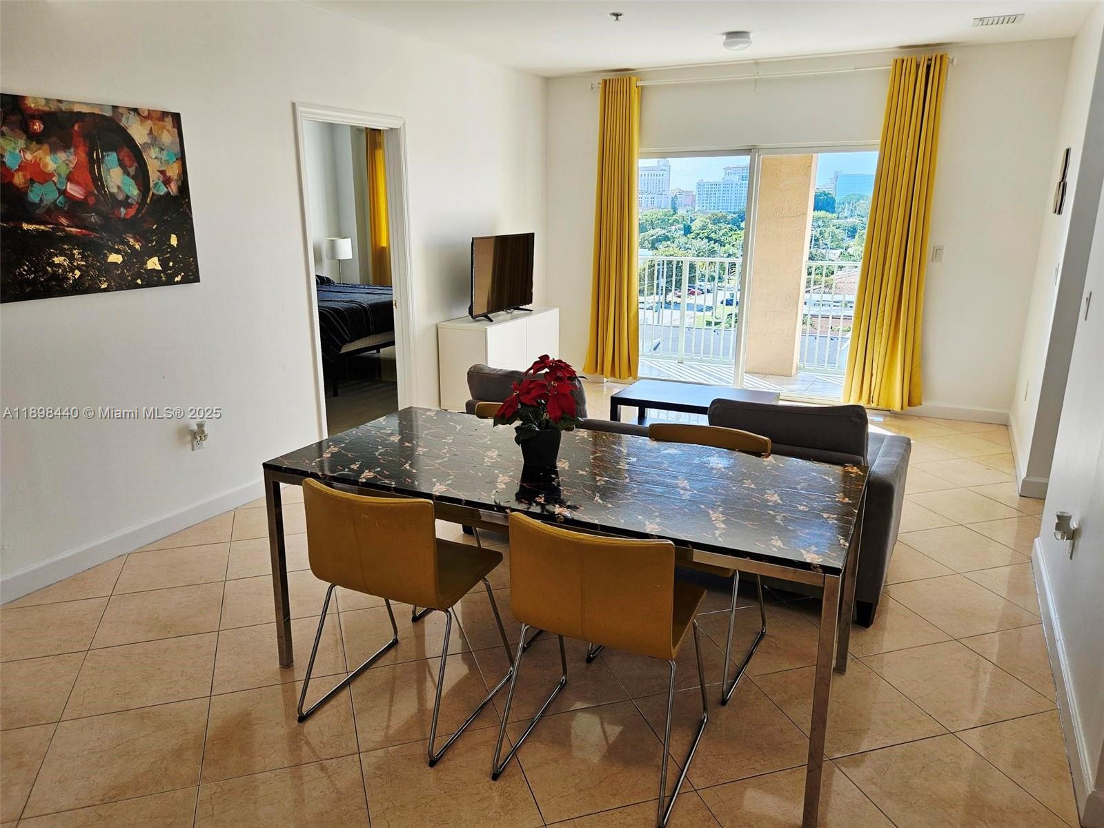 2280 Southwest 32nd Avenue, Unit 511 Miami, FL 33145 - Photo 7 of 17 a dining room with furniture and window