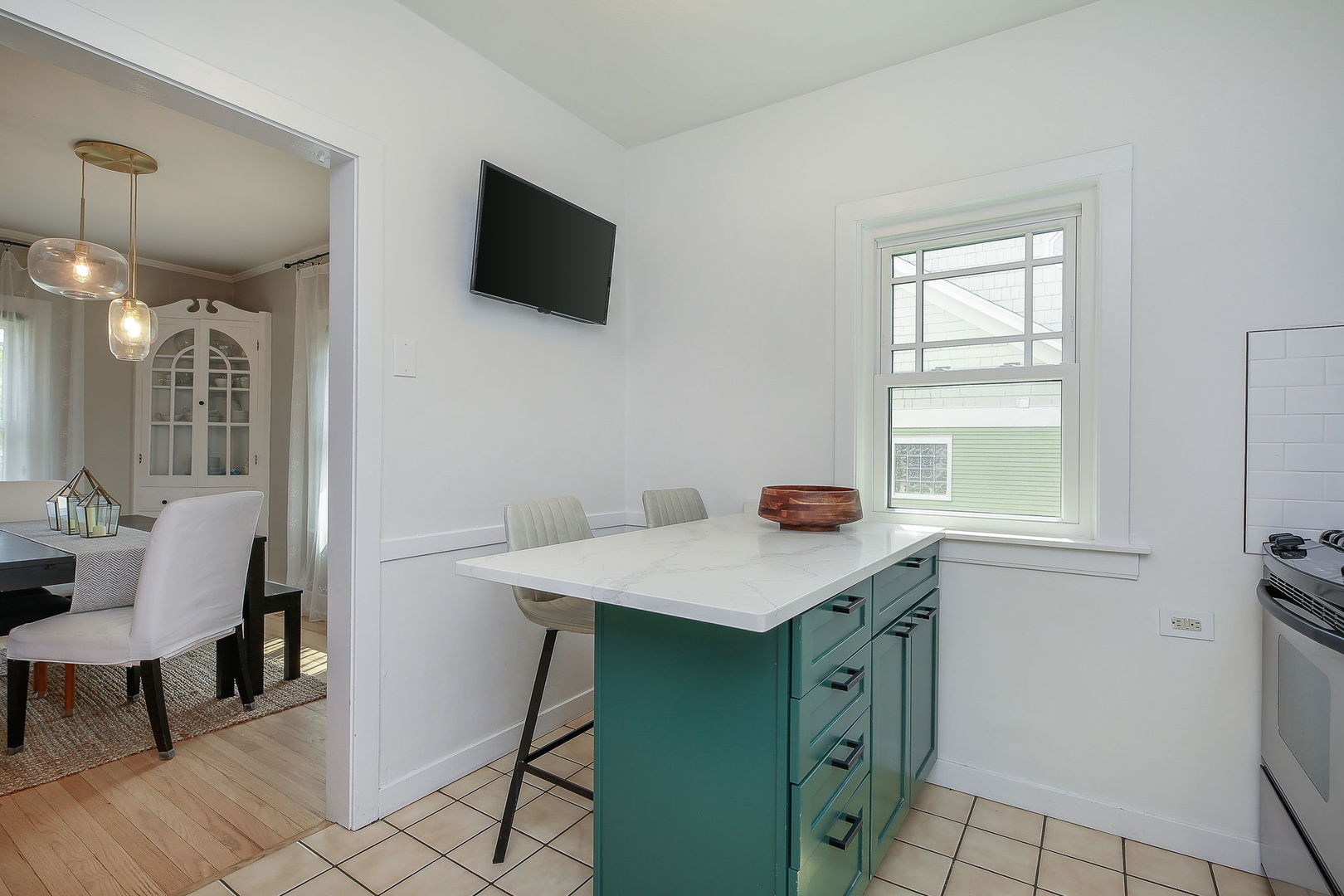 429 East Illinois Street Wheaton, IL 60187 - Photo 12 of 30 a kitchen with a sink cabinets and a wooden floor