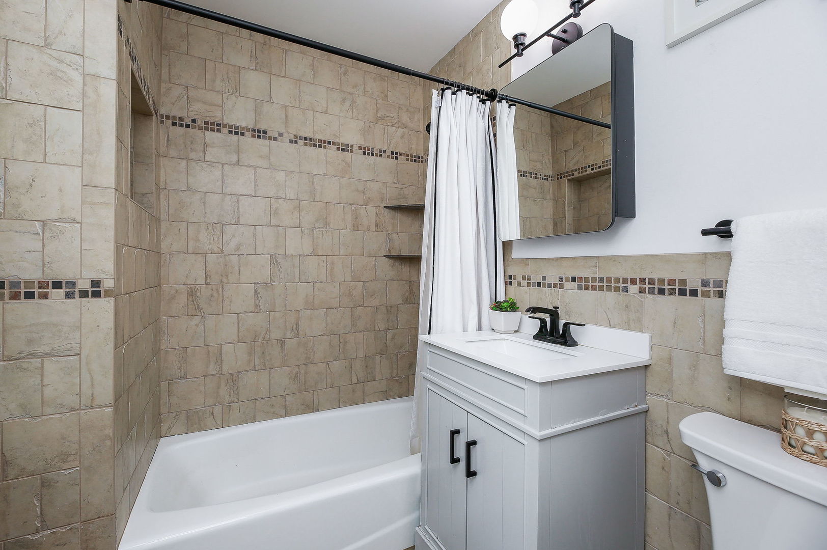 429 East Illinois Street Wheaton, IL 60187 - Photo 18 of 30 a bathroom with a sink vanity mirror and toilet