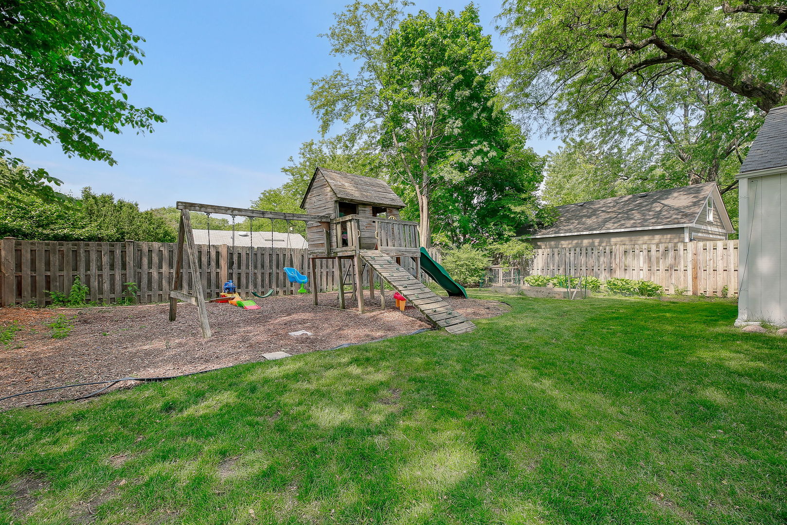 429 East Illinois Street Wheaton, IL 60187 - Photo 24 of 30 a view of a house with a yard and a park