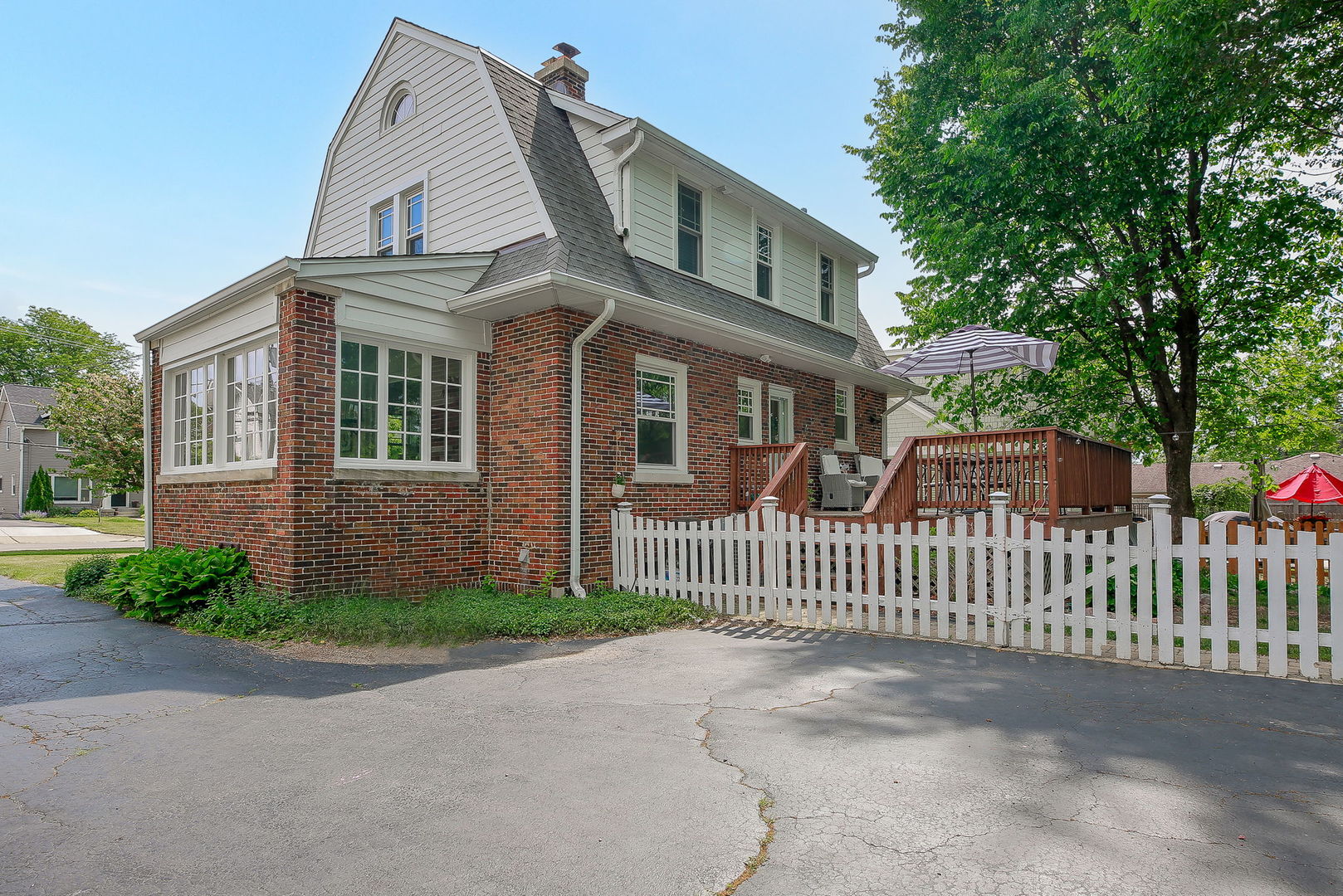 429 East Illinois Street Wheaton, IL 60187 - Photo 26 of 30 a front view of a house with a garden