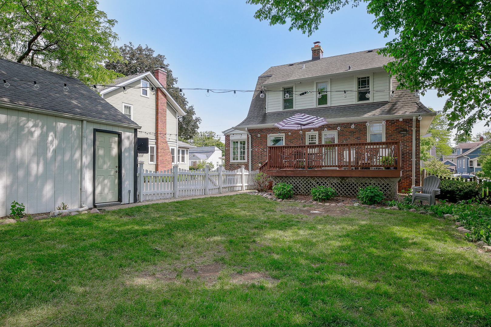 429 East Illinois Street Wheaton, IL 60187 - Photo 27 of 30 a front view of a house with a yard