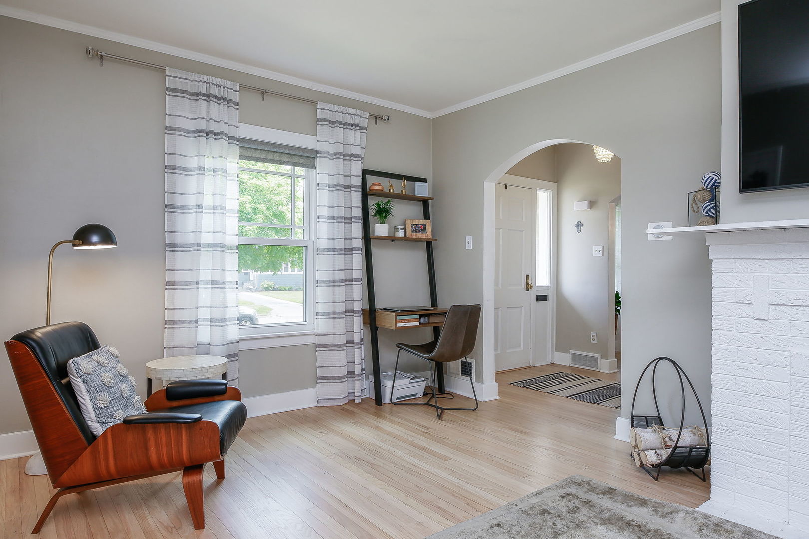 429 East Illinois Street Wheaton, IL 60187 - Photo 3 of 30 a living room with furniture and a flat screen tv
