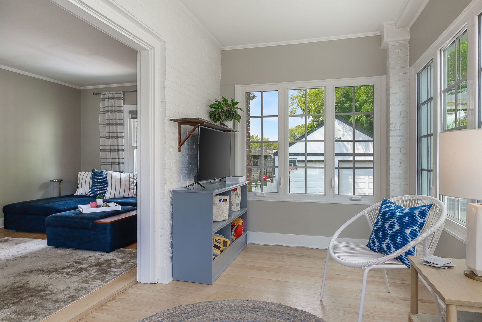 429 East Illinois Street Wheaton, IL 60187 - Photo 6 of 30 a living room with furniture and a flat screen tv