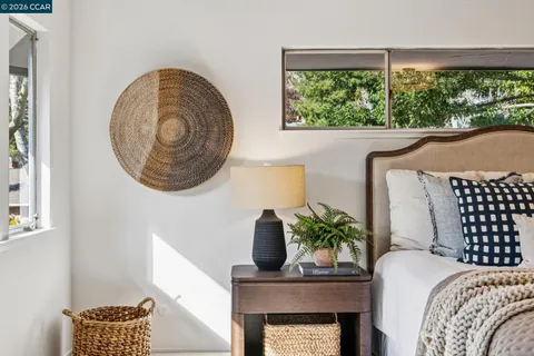 a bedroom with a bed and window