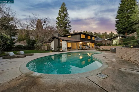 a view of a swimming pool with a patio