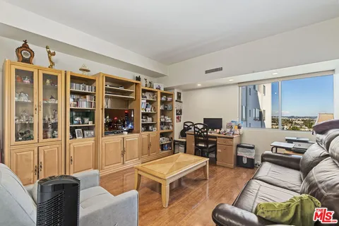 a living room with furniture and fireplace