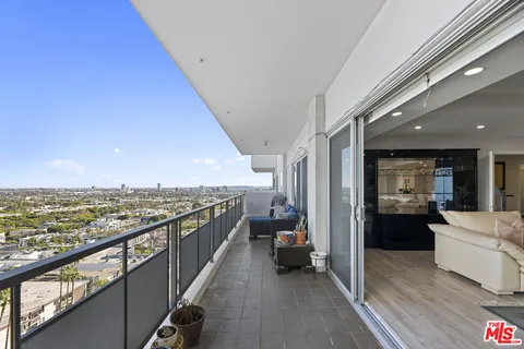 a view of a living room and a kitchen