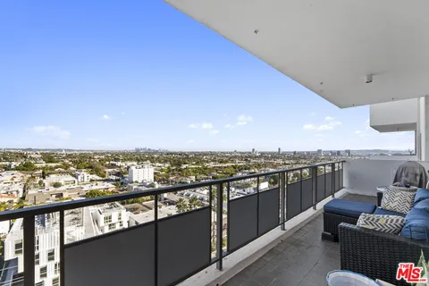 a view of a balcony with city view