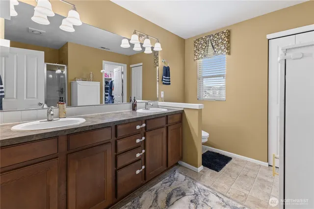 a bathroom with a glass shower door