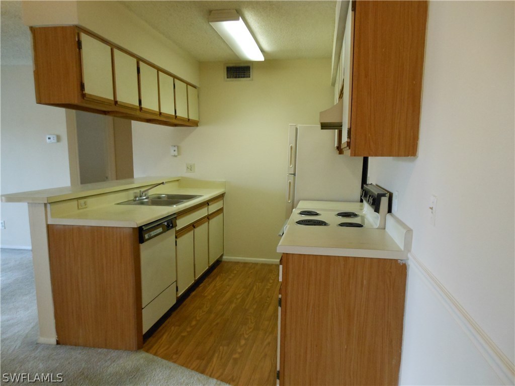 5311 Summerlin Road, Unit 1115 Fort Myers, FL 33919 - Photo 3 of 14 a utility room with washer and dryer