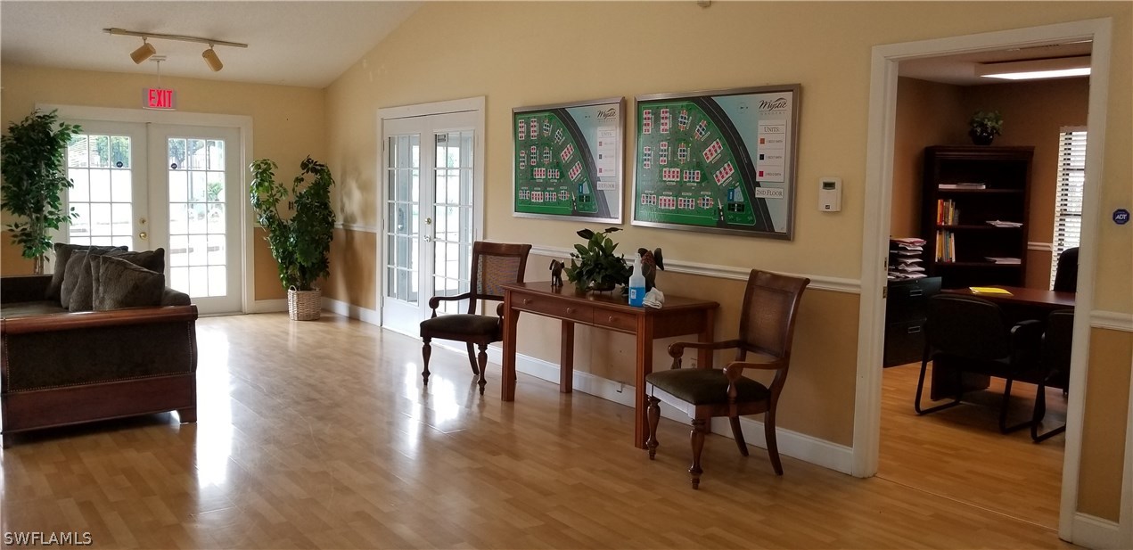 5311 Summerlin Road, Unit 1115 Fort Myers, FL 33919 - Photo 10 of 14 a view of a livingroom and dining room with furniture window and wooden floor