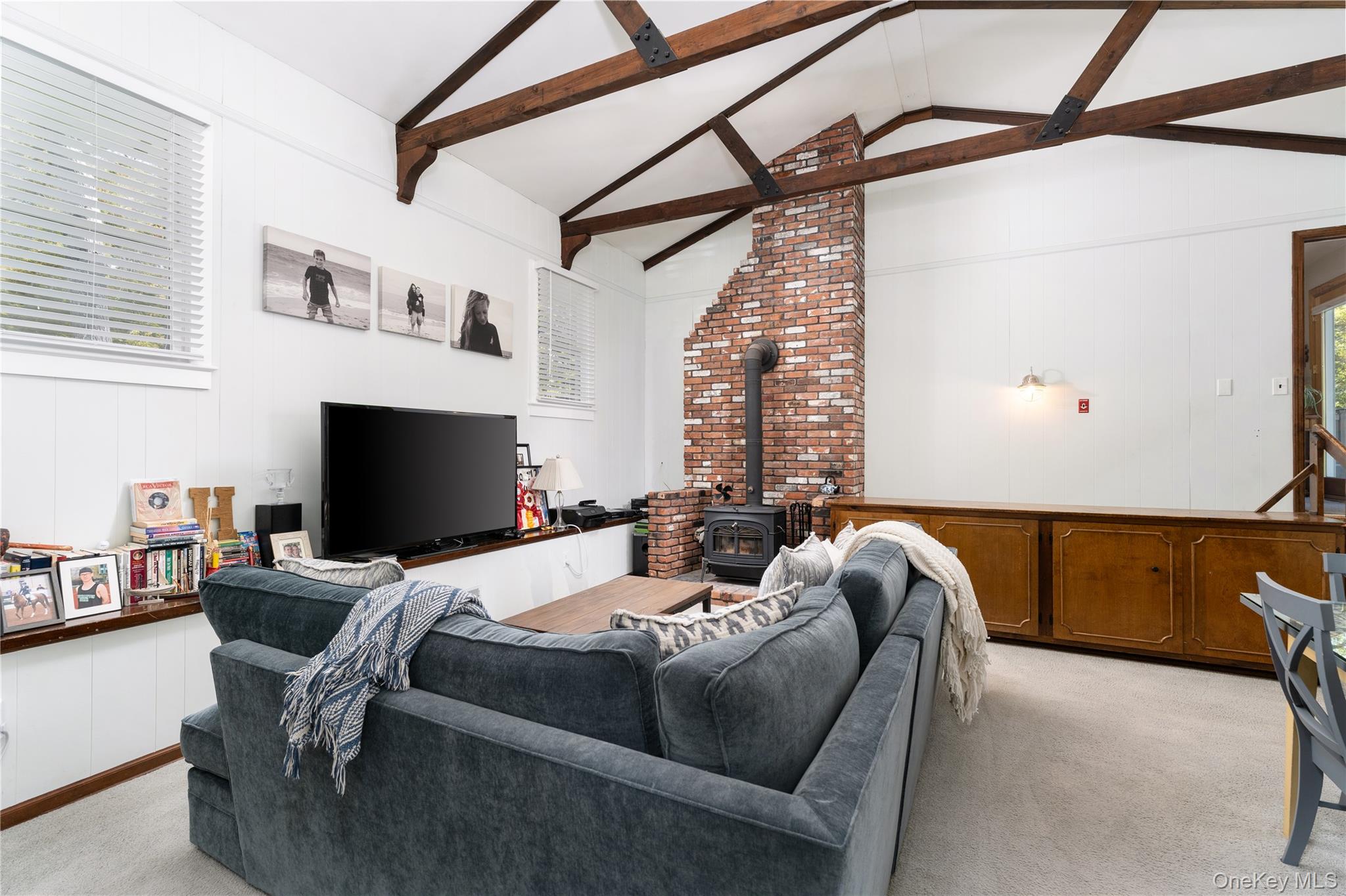 8 Foxboro Road Hampton Bays, NY 11946 - Photo 20 of 50 a bedroom with furniture and a flat screen tv