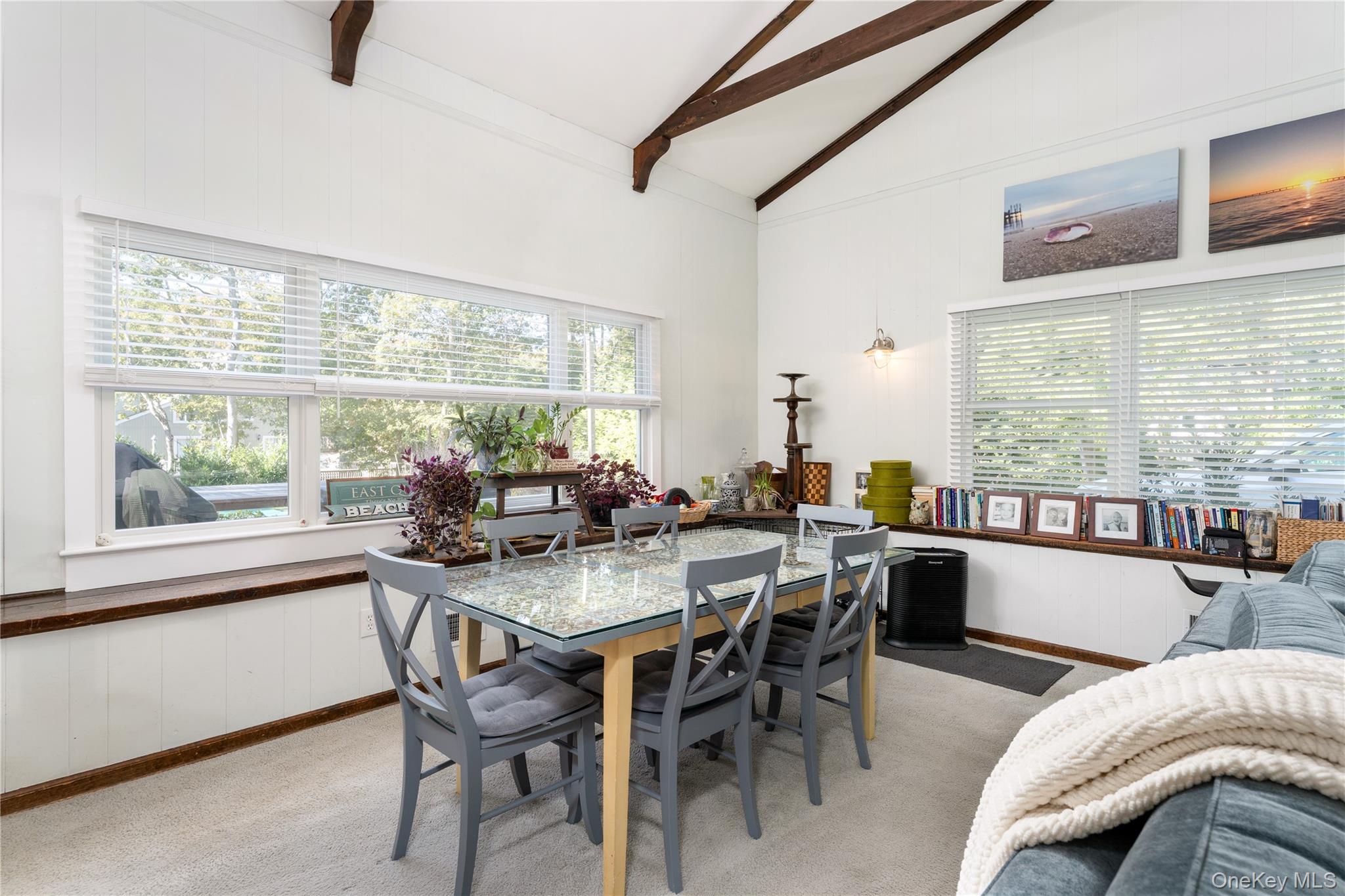 8 Foxboro Road Hampton Bays, NY 11946 - Photo 22 of 50 a view of a dining room with furniture window and outside view