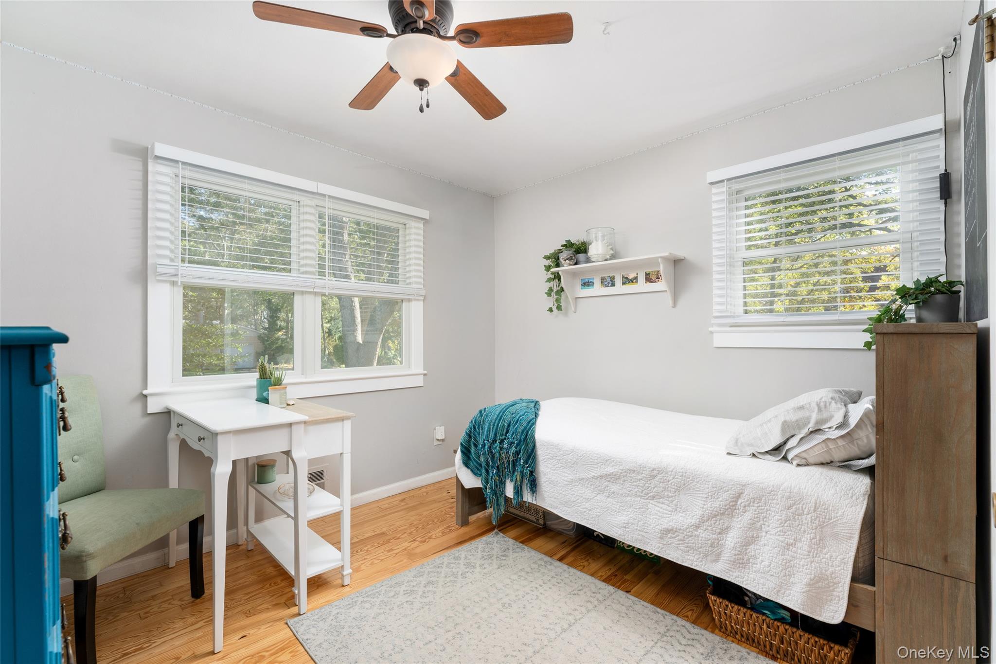 8 Foxboro Road Hampton Bays, NY 11946 - Photo 25 of 50 a bedroom with a bed and a window