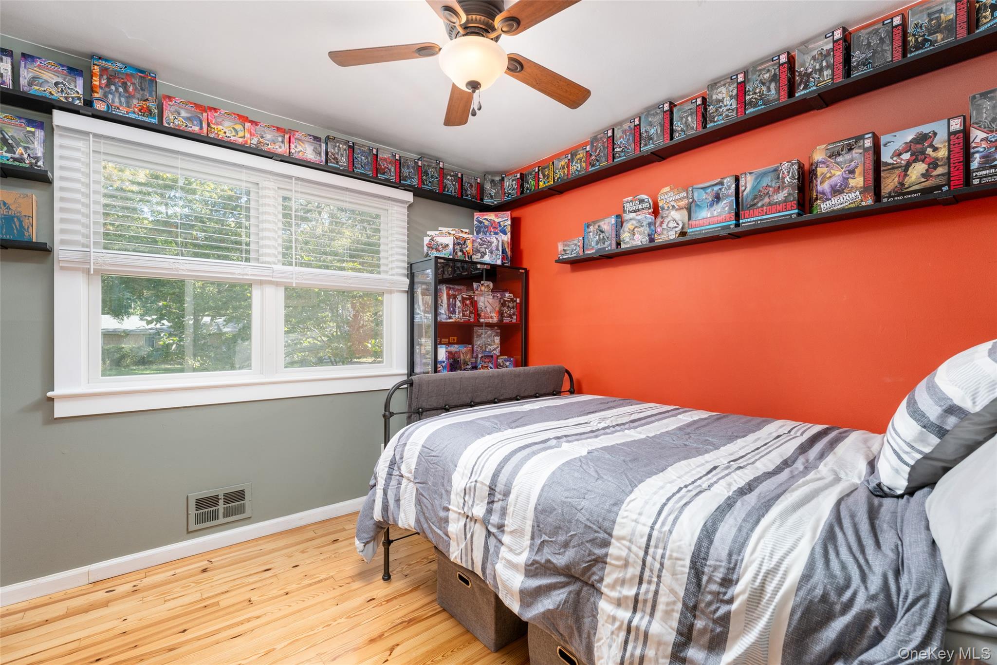 8 Foxboro Road Hampton Bays, NY 11946 - Photo 26 of 50 a bedroom with a bed and a window