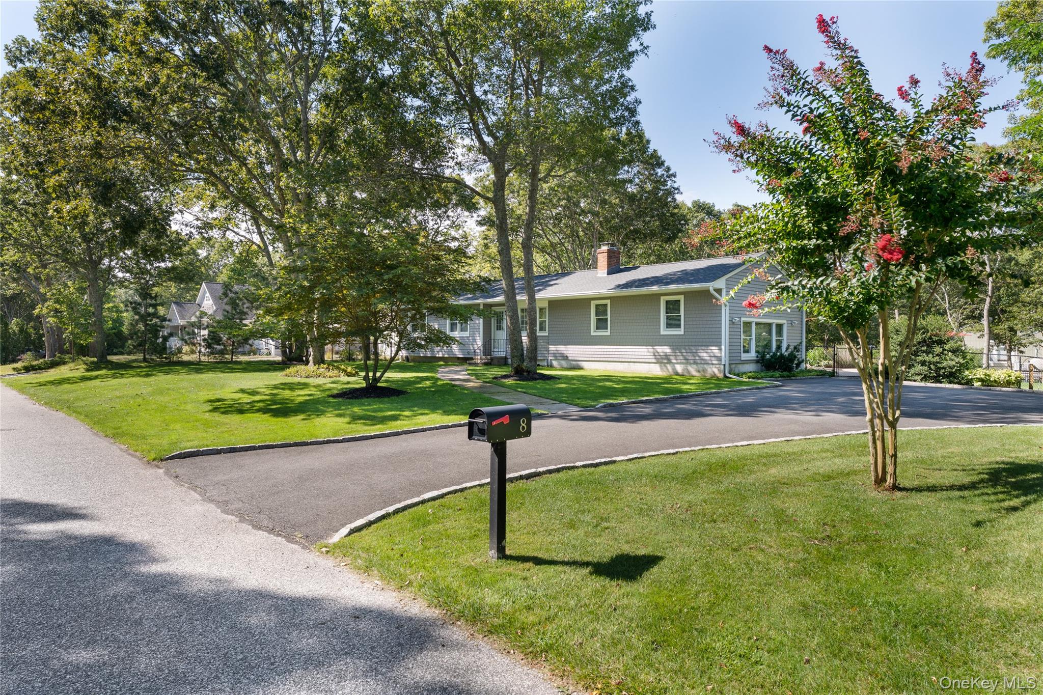 8 Foxboro Road Hampton Bays, NY 11946 - Photo 27 of 50 a front view of a house with a yard and tree