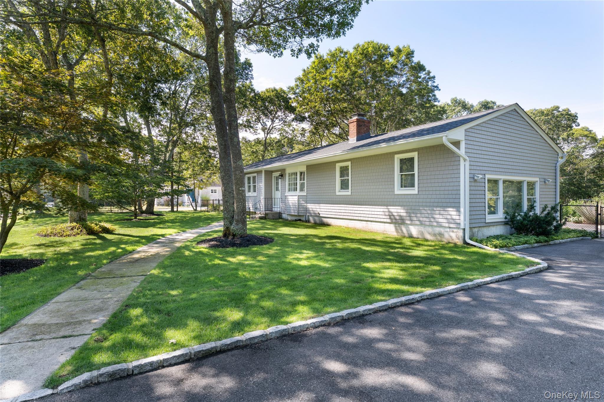 8 Foxboro Road Hampton Bays, NY 11946 - Photo 28 of 50 a front view of house with yard and green space
