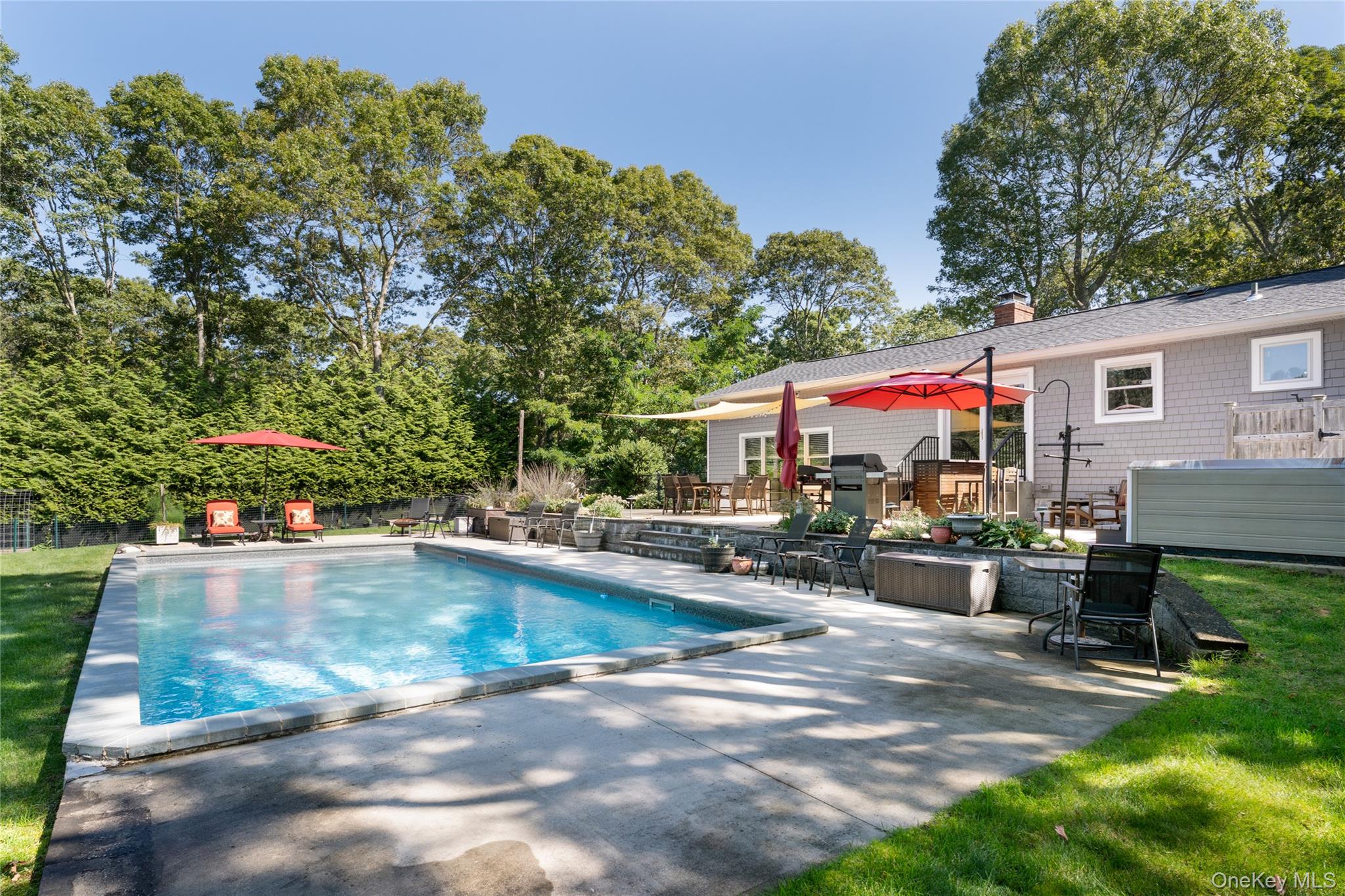 8 Foxboro Road Hampton Bays, NY 11946 - Photo 30 of 50 a view of a house with sitting area and sitting area