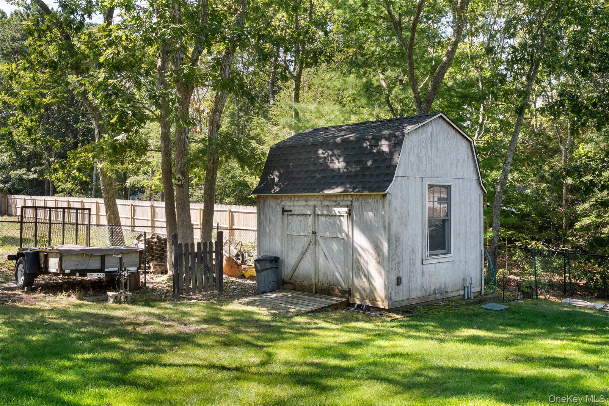 8 Foxboro Road Hampton Bays, NY 11946 - Photo 32 of 50 a view of a house with backyard