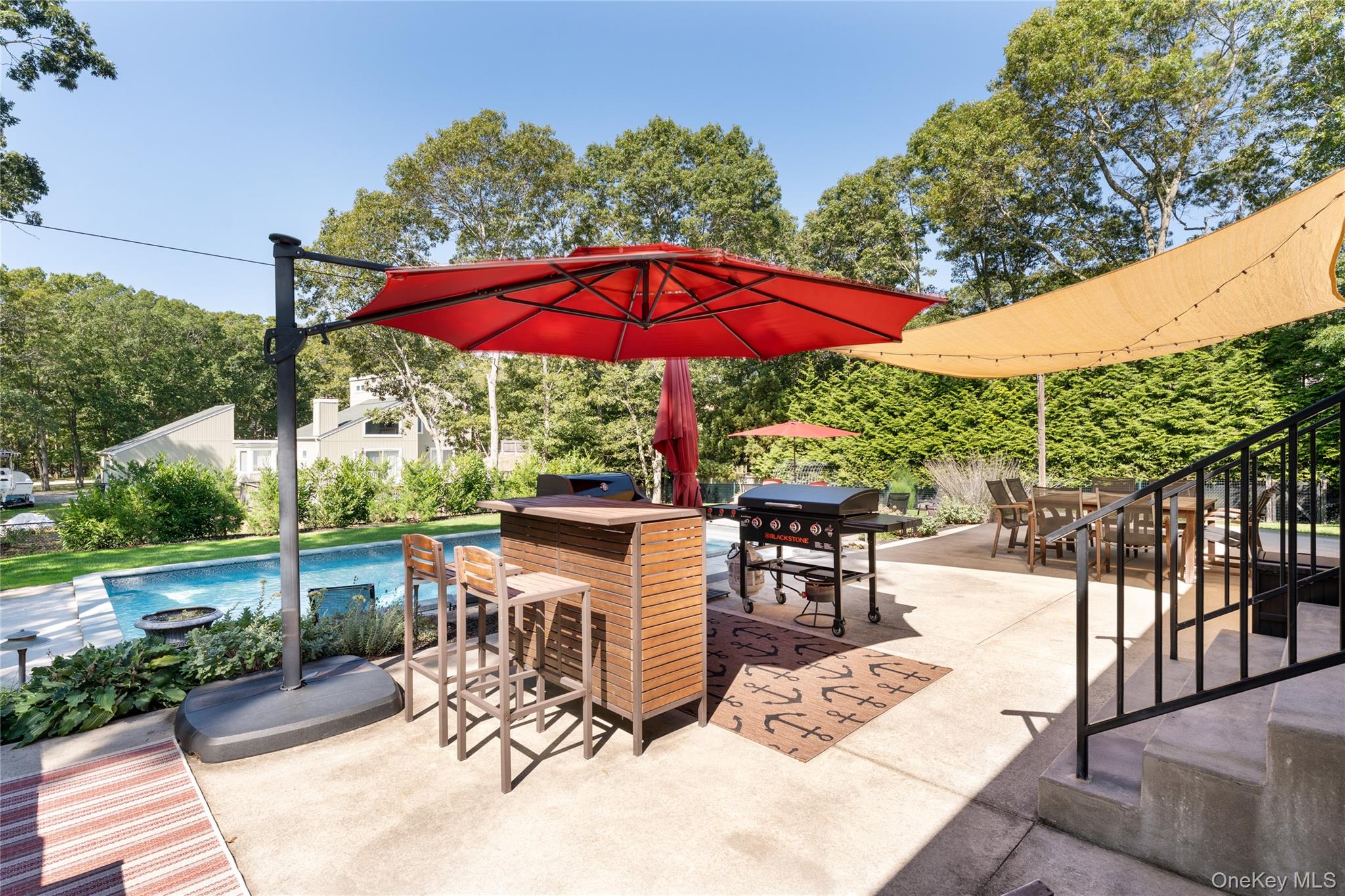 8 Foxboro Road Hampton Bays, NY 11946 - Photo 36 of 50 an outdoor view with patio