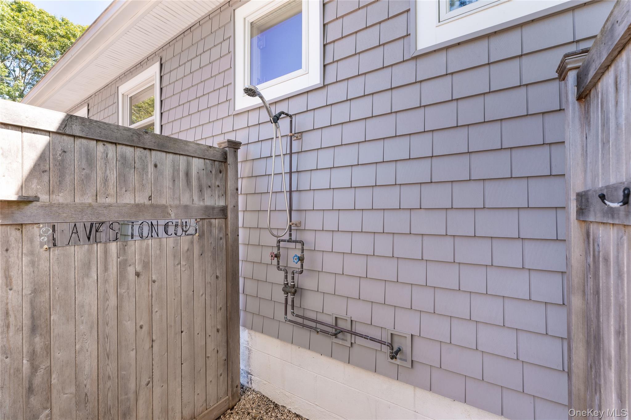 8 Foxboro Road Hampton Bays, NY 11946 - Photo 37 of 50 a bathroom with a bathtub and shower