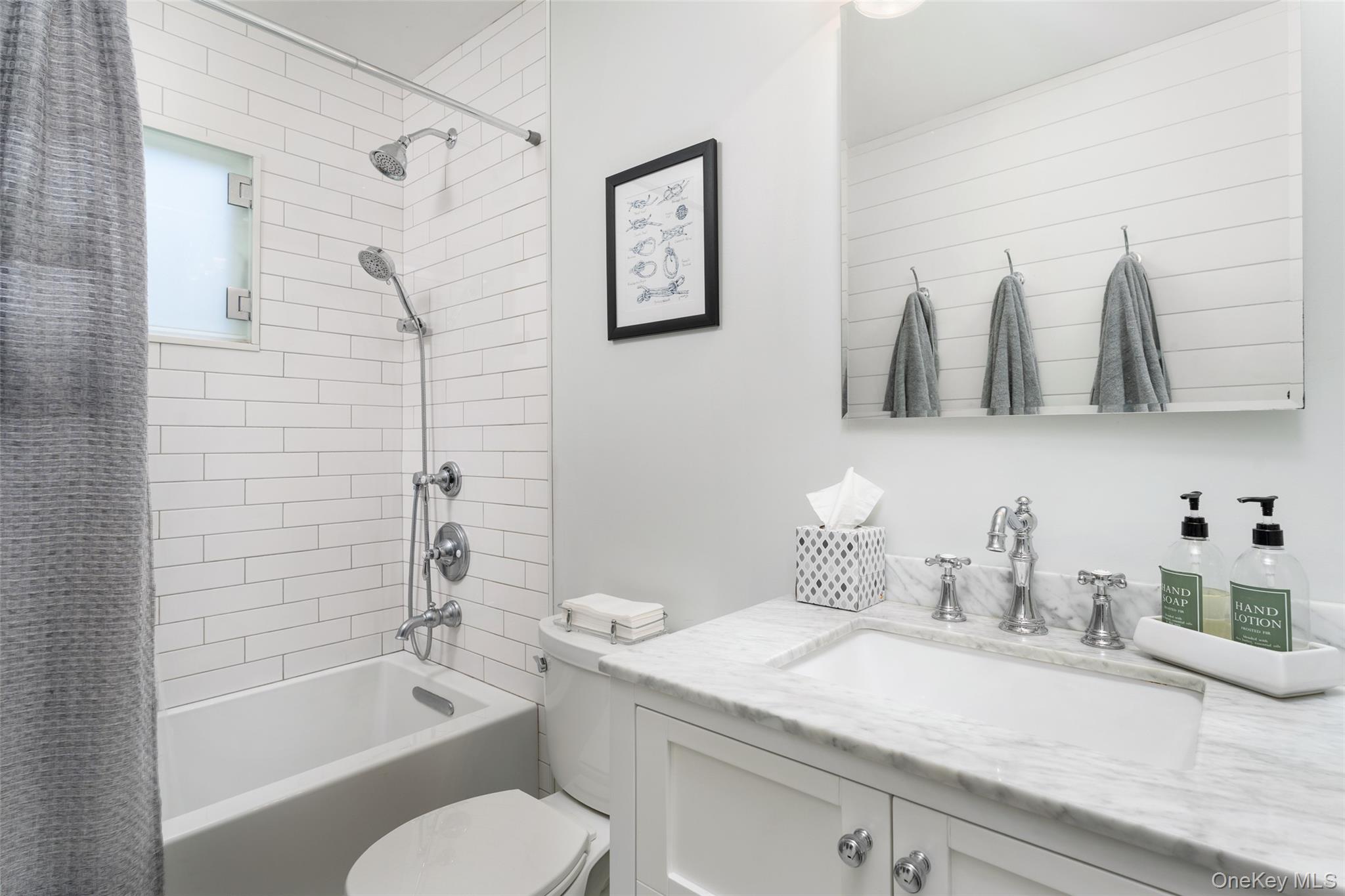 8 Foxboro Road Hampton Bays, NY 11946 - Photo 50 of 50 a bathroom with a sink a toilet and shower