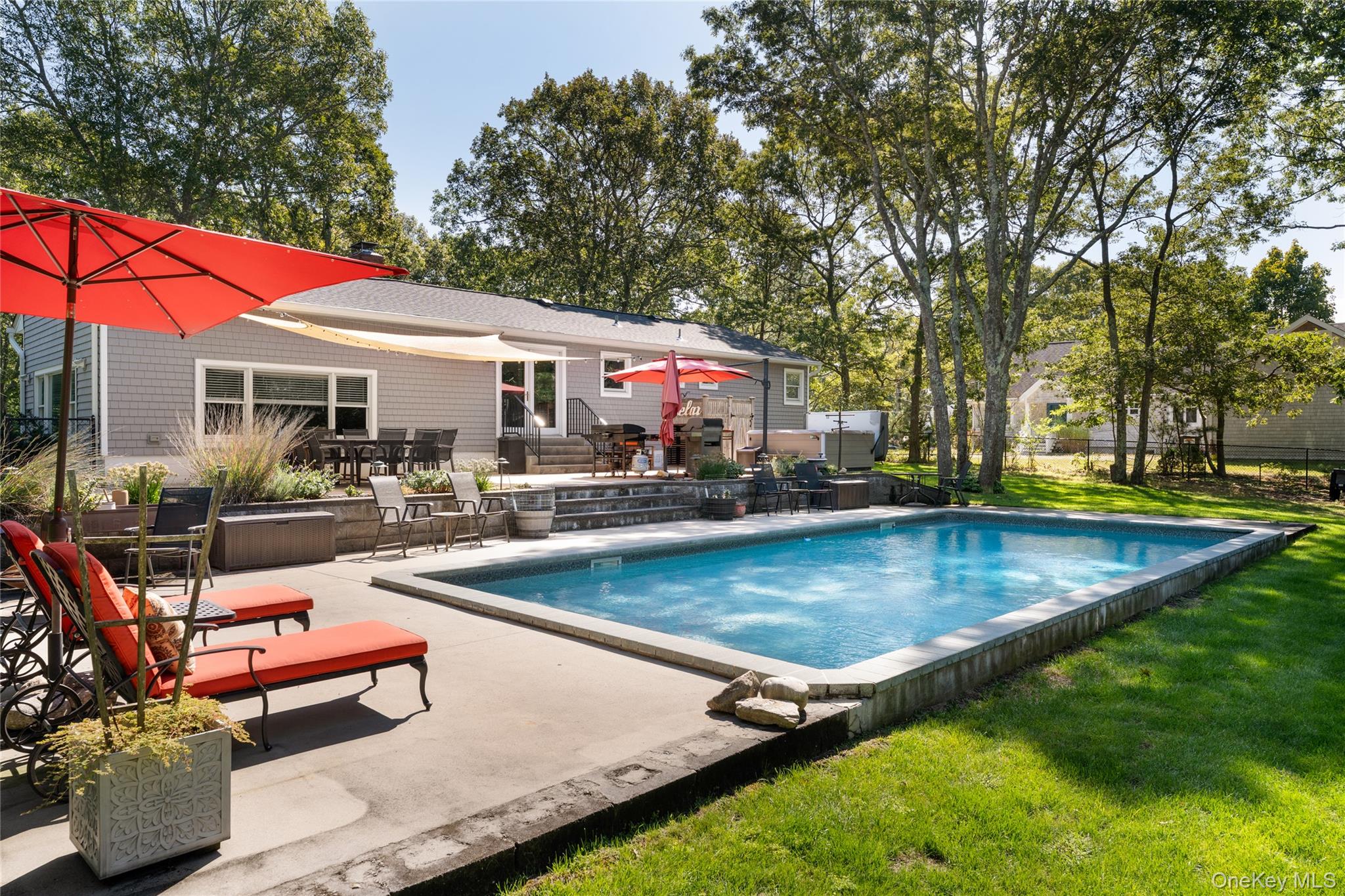 8 Foxboro Road Hampton Bays, NY 11946 - Photo 6 of 50 a view of a house with swimming pool and sitting area