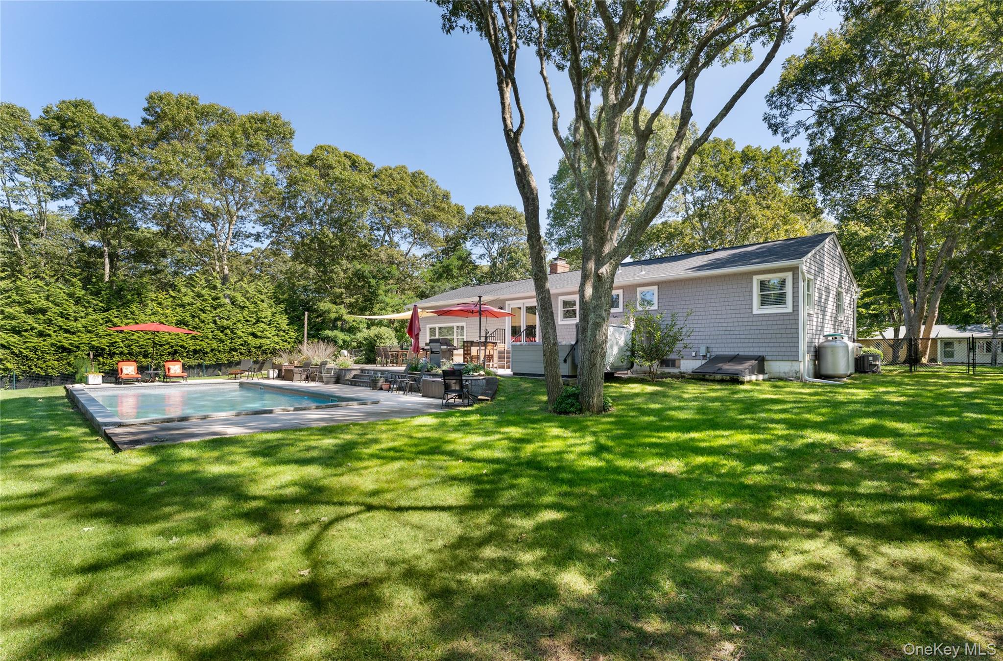 8 Foxboro Road Hampton Bays, NY 11946 - Photo 7 of 50 a view of a house with backyard and sitting area
