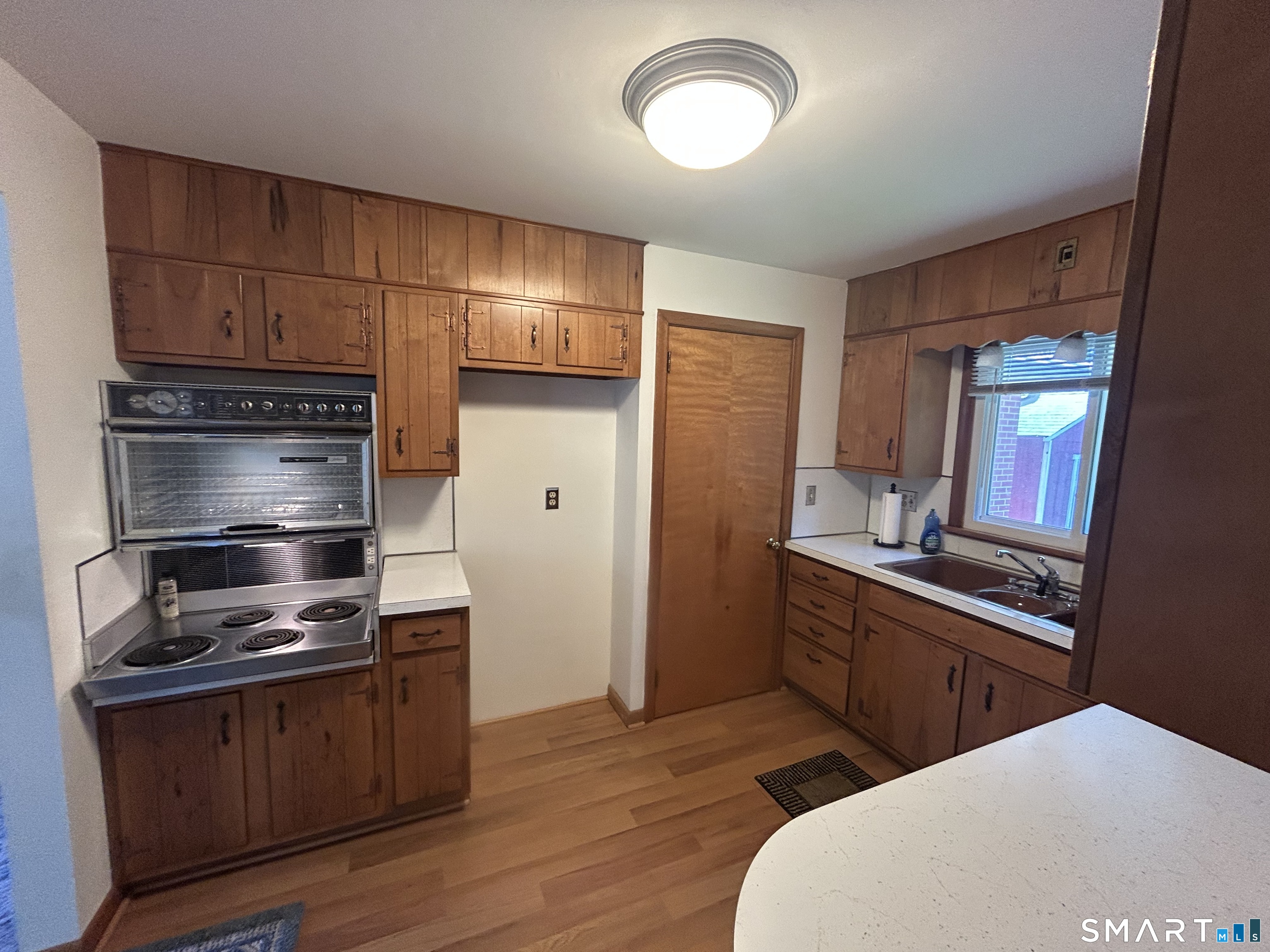 13 Walnut Lane Wallingford, CT 06492 - Photo 7 of 27 a kitchen with a refrigerator stove and sink