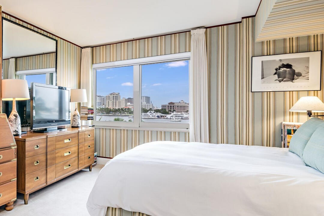 44 Cocoanut Row, Unit 320B Palm Beach, FL 33480 - Photo 13 of 27 a bedroom with a large bed and a window