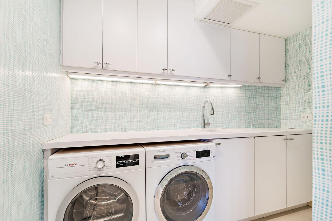 44 Cocoanut Row, Unit 320B Palm Beach, FL 33480 - Photo 17 of 27 a utility room with dryer and washer