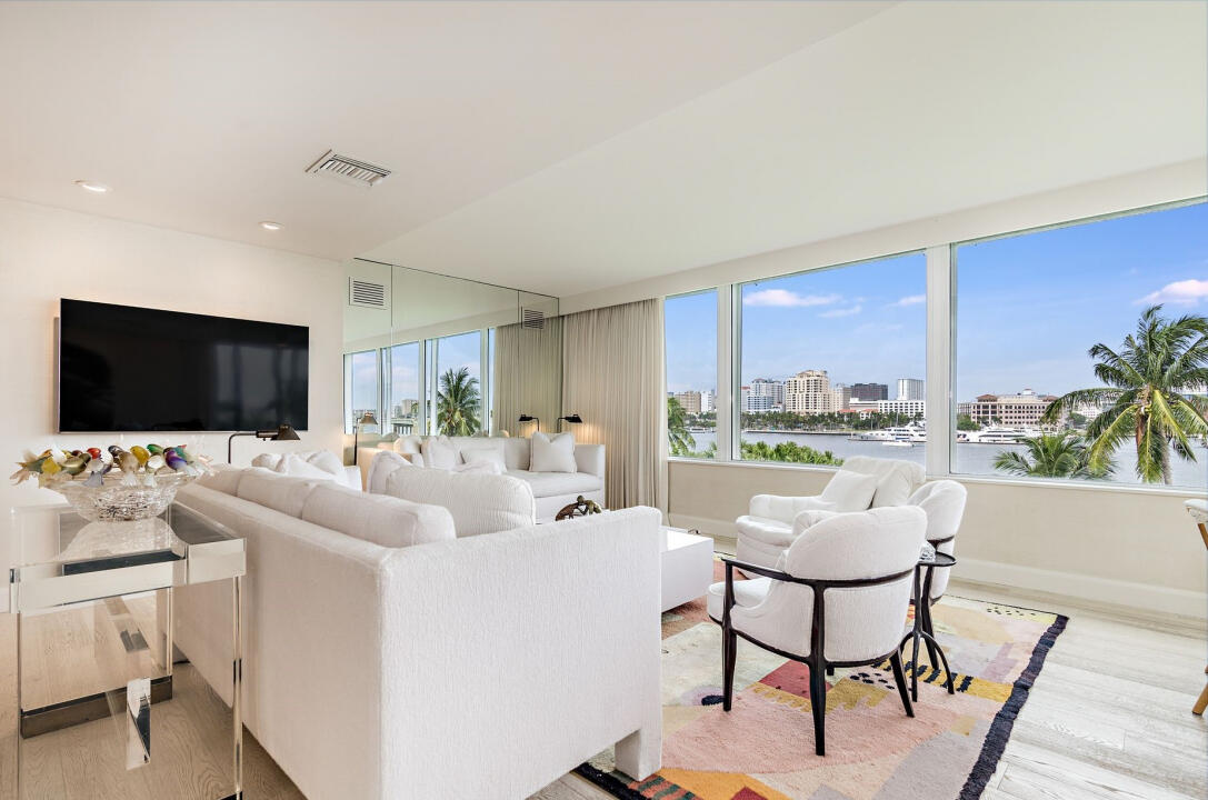 44 Cocoanut Row, Unit 320B Palm Beach, FL 33480 - Photo 2 of 27 a living room with furniture and a flat screen tv